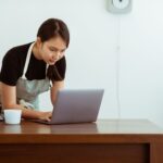 Small business owner working on a laptop