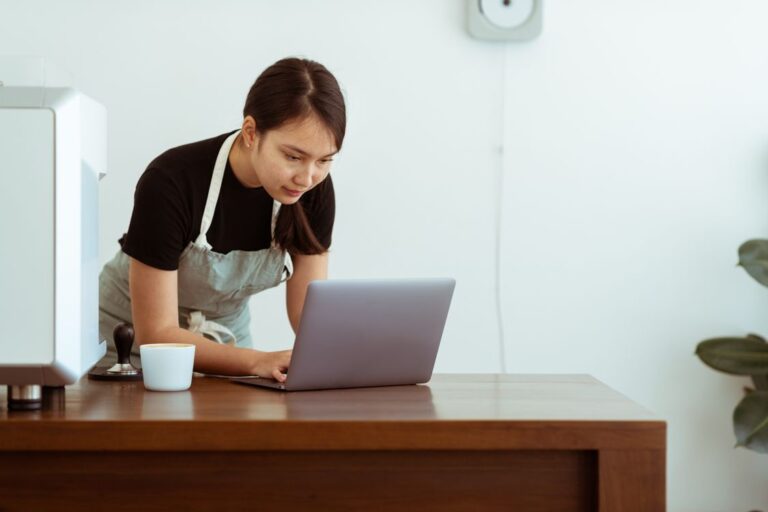 Small business owner working on a laptop