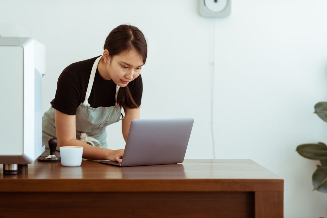 Small business owner working on a laptop